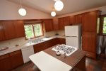 Kitchen with vaulted ceilings and center island, washer/dryer